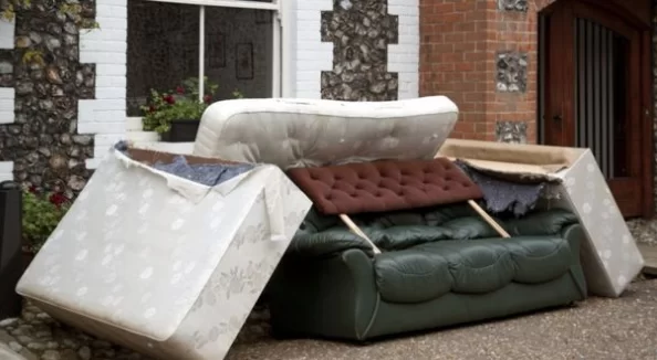 bulky waste mattresses and sofas left outside house for collection and disposal
