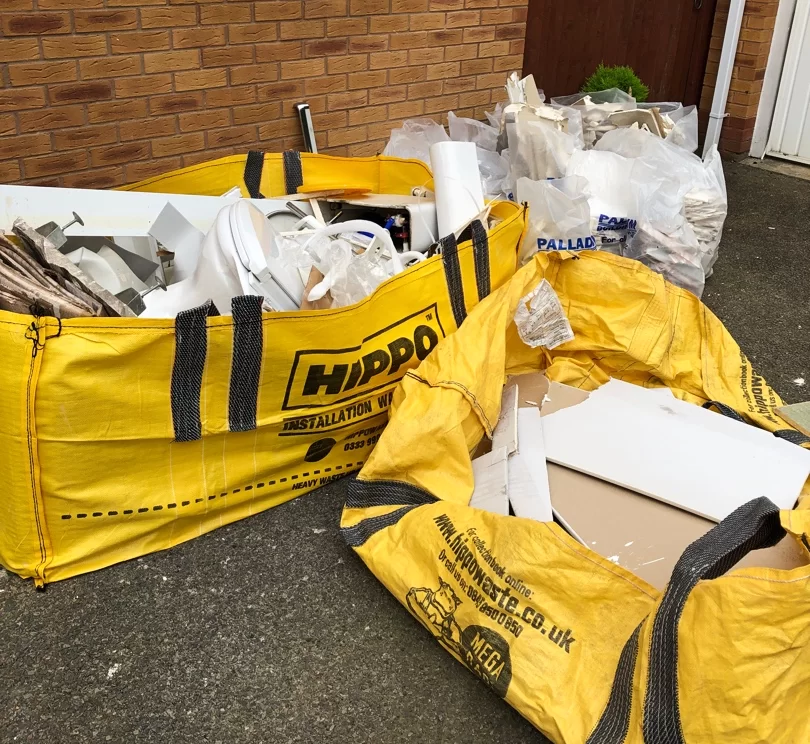 two yello hippobag skip bags filled with plasterboard waste