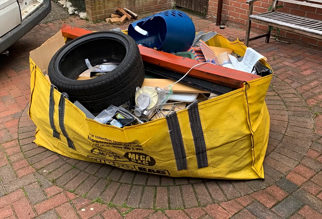 hippo skip bag with waste and tyre